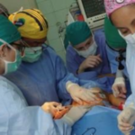 Performing surgery on burned children from the Peruvian Jungle during a medical mission.